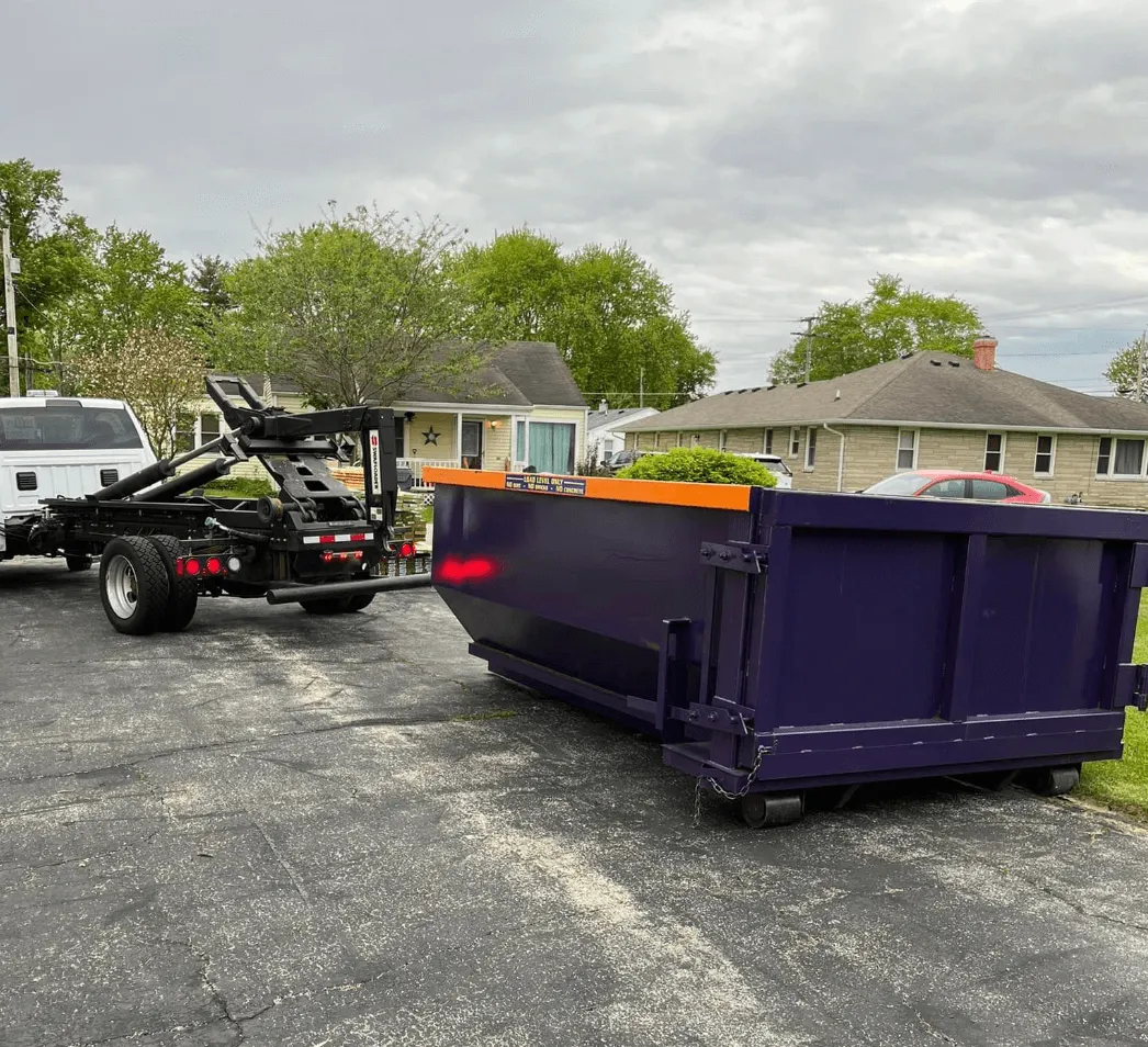 dumpster being placed in driveway